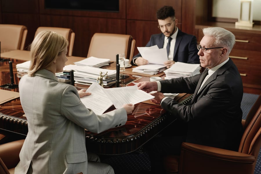 biracial-group-of-attorneys-working-with-documents-2024-01-26-13-50-42-utc