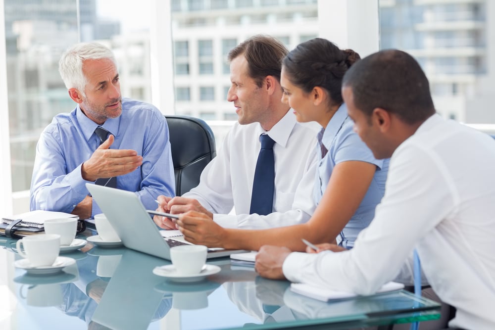 Group of business people brainstorming together in the meeting room